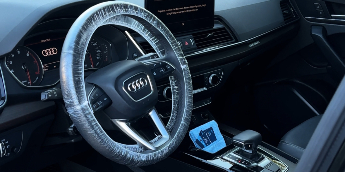 Audi interior with the steering wheel wrapped during an interior detail, Arlington Heights