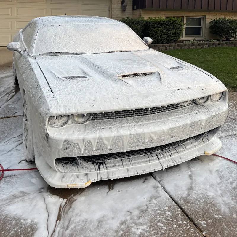 Dodge Challenger SRT covered in wash foam during an exterior detail