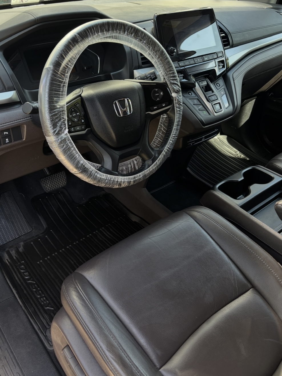 Honda SUV interior after a full interior detail, steering wheel wrapped in a protective cover