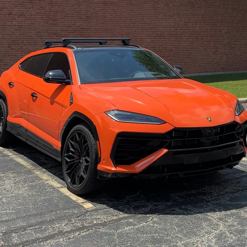 Orange Lamborghini Urus before an exterior detail