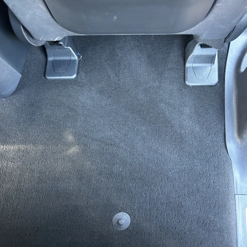 Carpet behind the front seat clean after interior car detailing, Arlington Heights